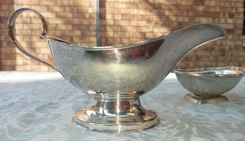 TWO VINTAGE UTENSILS A SAUCE BOAT AND A BUTTER DISH SOLD AS IS