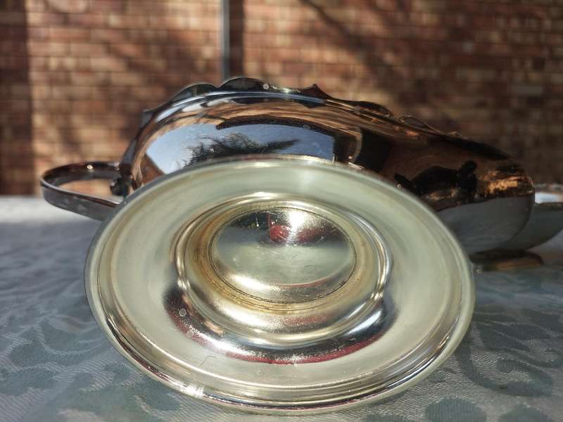 TWO VINTAGE UTENSILS A SAUCE BOAT AND A BUTTER DISH SOLD AS IS