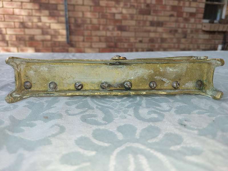 A VINTAGE BRASS CAST HANNUKKA MENORAH WITH LION CRESTS SOLD AS IS