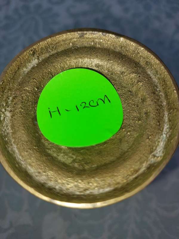 A SET OF ORNATE BRASS CANDLE HOLDERS SOLD AS IS