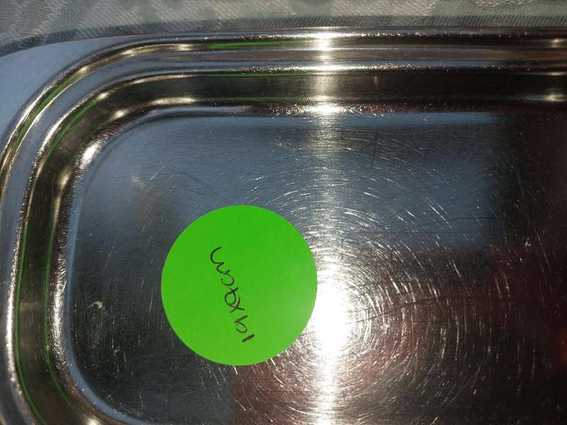 TWO STAINLESS STEEL UTENSILS A BUTTER DISH AND A TOAST STAND SOLD AS IS