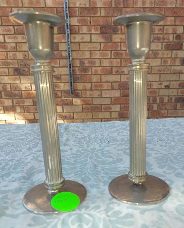 A VINTAGE SET OF ROMAN STYLE SILVER PLATED CANDLE HOLDERS SOLD AS IS