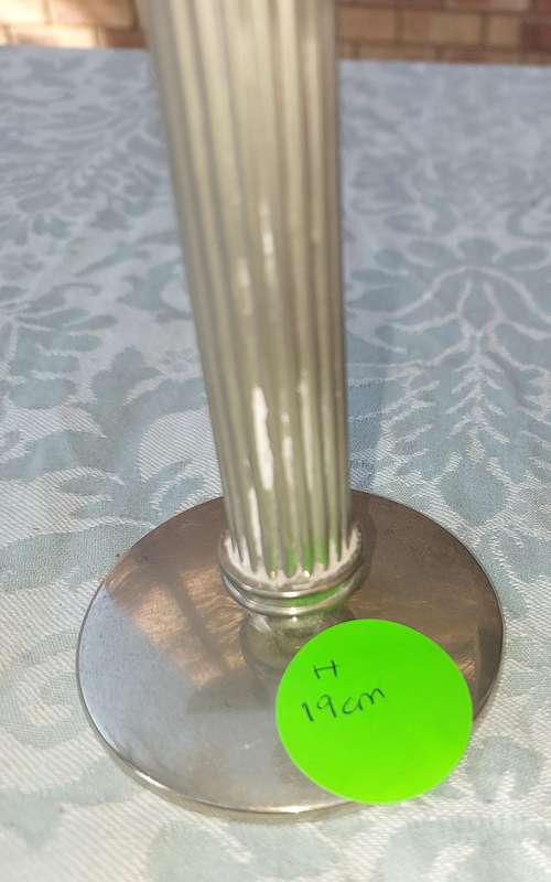 A VINTAGE SET OF ROMAN STYLE SILVER PLATED CANDLE HOLDERS SOLD AS IS