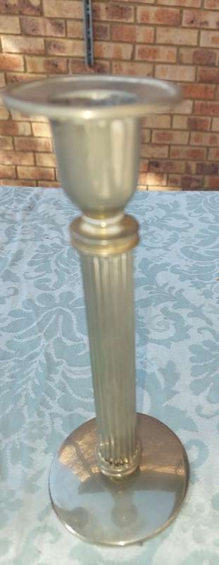 A VINTAGE SET OF ROMAN STYLE SILVER PLATED CANDLE HOLDERS SOLD AS IS
