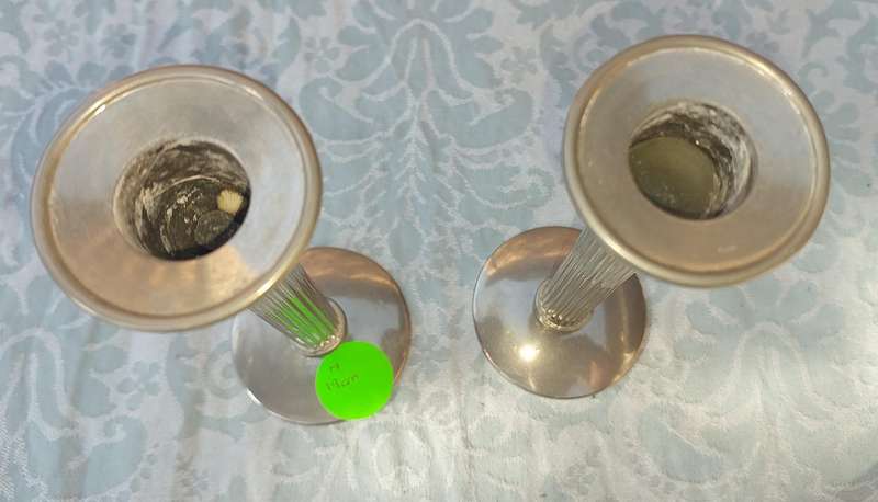 A VINTAGE SET OF ROMAN STYLE SILVER PLATED CANDLE HOLDERS SOLD AS IS