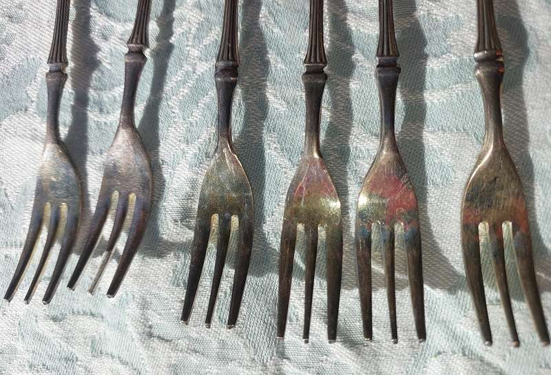 A VINTAGE SET OF DESERT FORKS SOLD AS IS