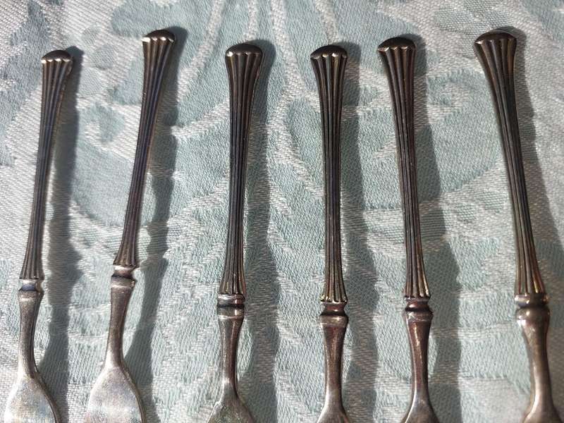 A VINTAGE SET OF DESERT FORKS SOLD AS IS