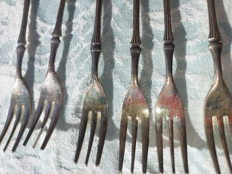 A VINTAGE SET OF DESERT FORKS SOLD AS IS
