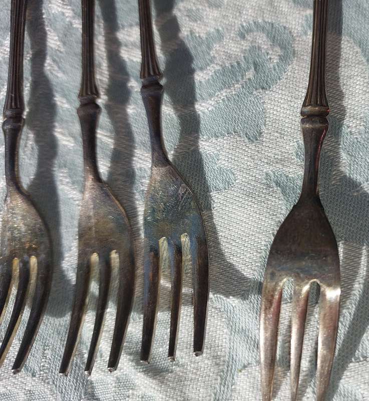 A VINTAGE SET OF DESERT FORKS SOLD AS IS
