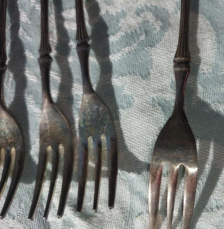 A VINTAGE SET OF DESERT FORKS SOLD AS IS
