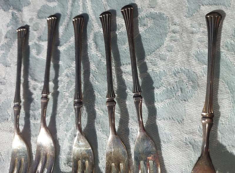 A VINTAGE SET OF DESERT FORKS SOLD AS IS