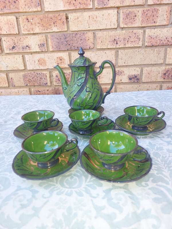 AN ART DECOR TEASET GREEN BAKED CERAMIC SOLD AS IS