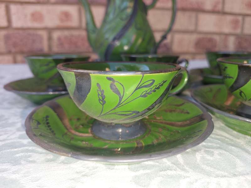 AN ART DECOR TEASET GREEN BAKED CERAMIC SOLD AS IS