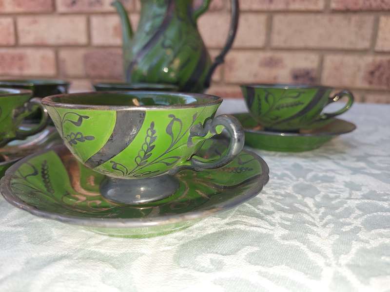 AN ART DECOR TEASET GREEN BAKED CERAMIC SOLD AS IS