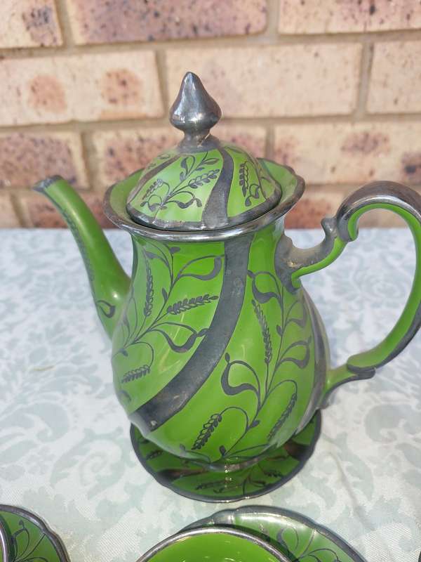 AN ART DECOR TEASET GREEN BAKED CERAMIC SOLD AS IS