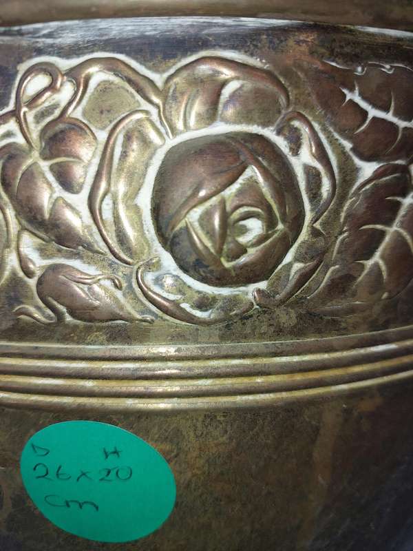 AN ORNATE BRASS PLANTER SOLD AS IS
