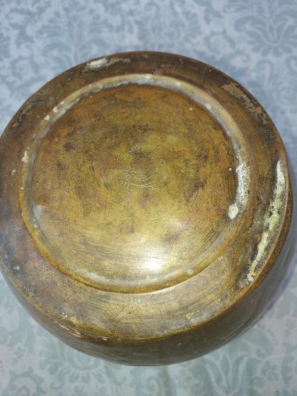 AN ORNATE BRASS PLANTER SOLD AS IS