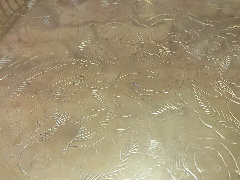 A BRASS SERVING TRAY MADE IN INFIA SOLD AS IS