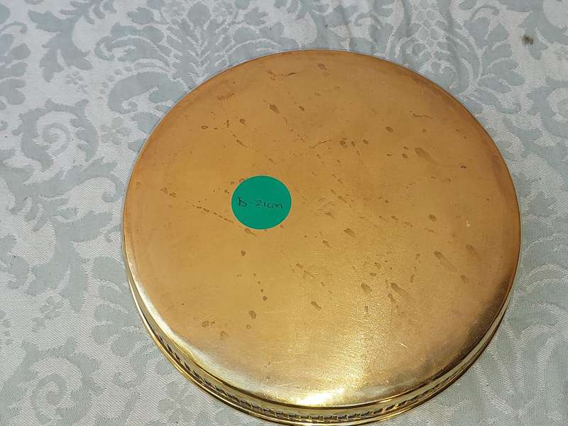 A BRASS SERVING TRAY MADE IN INFIA SOLD AS IS