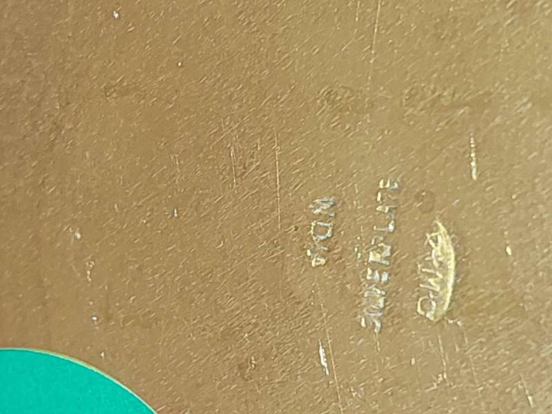 A BRASS SERVING TRAY MADE IN INFIA SOLD AS IS