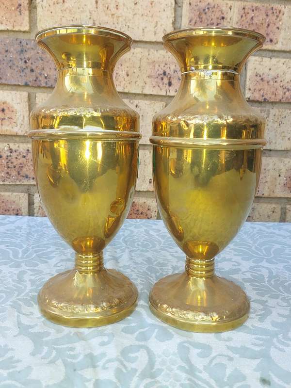 A PAIR OF ORNATE BRASS VASES SOLD AS IS
