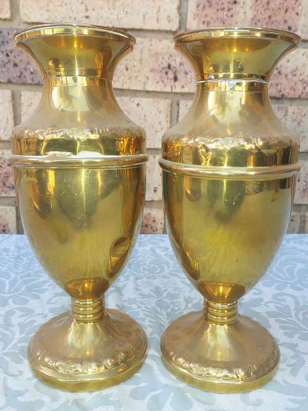 A PAIR OF ORNATE BRASS VASES SOLD AS IS