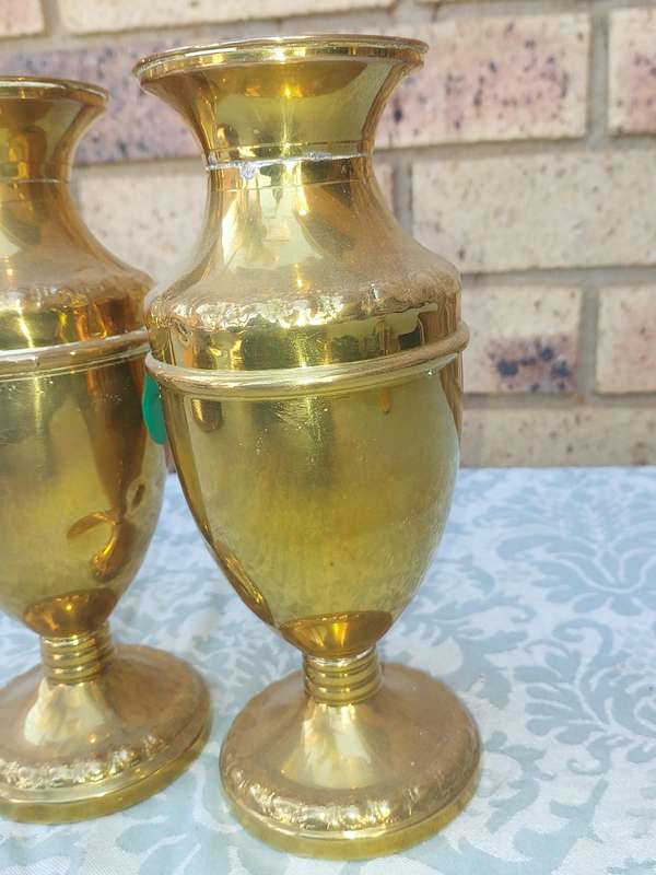 A PAIR OF ORNATE BRASS VASES SOLD AS IS