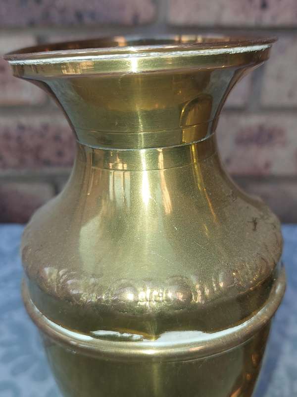A PAIR OF ORNATE BRASS VASES SOLD AS IS