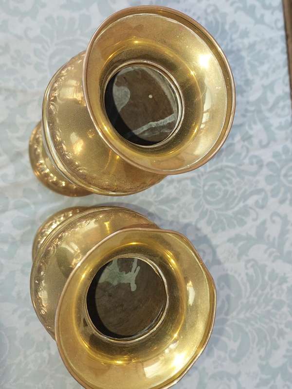 A PAIR OF ORNATE BRASS VASES SOLD AS IS