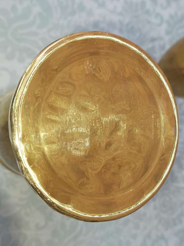 A PAIR OF ORNATE BRASS VASES SOLD AS IS