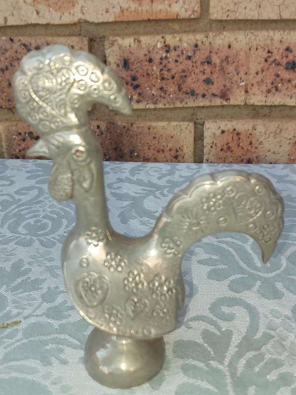A COLLECTORS PORTUGESE SILVERPLATED ROOSTER AND A BOTTLE OPENER WITH THE ROOSTER SOLD AS IS