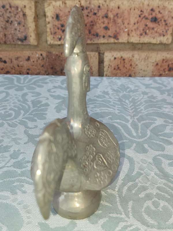 A COLLECTORS PORTUGESE SILVERPLATED ROOSTER AND A BOTTLE OPENER WITH THE ROOSTER SOLD AS IS