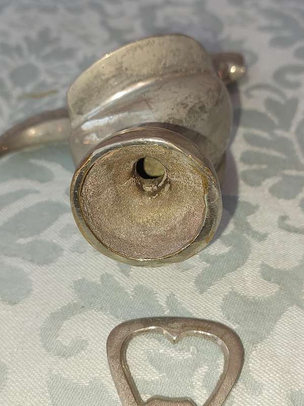 A COLLECTORS PORTUGESE SILVERPLATED ROOSTER AND A BOTTLE OPENER WITH THE ROOSTER SOLD AS IS