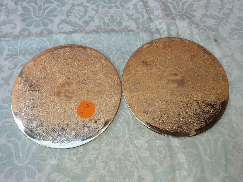 A PAIR OF ORNATE SILVER PLATED HOTPOT PLACE MATS
