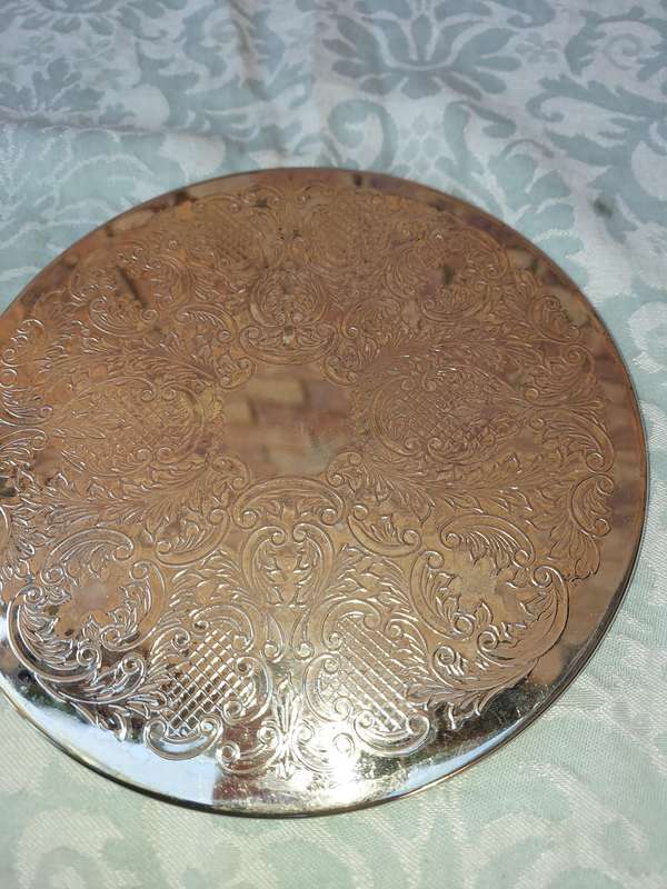 A PAIR OF ORNATE SILVER PLATED HOTPOT PLACE MATS