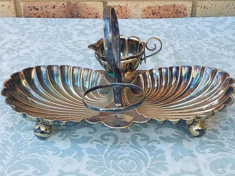 A VINTAGE BRIDAL BAROQUE SERVER FOOTED SOLD AS IS