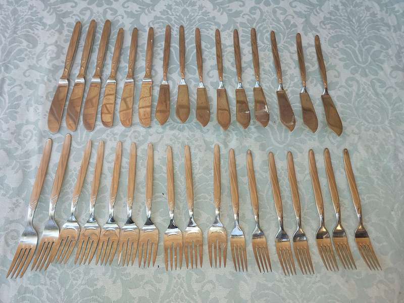 A SET OF VINTAGE GERMAN STAINLESS STEEL CUTLERY SOLD AS IS