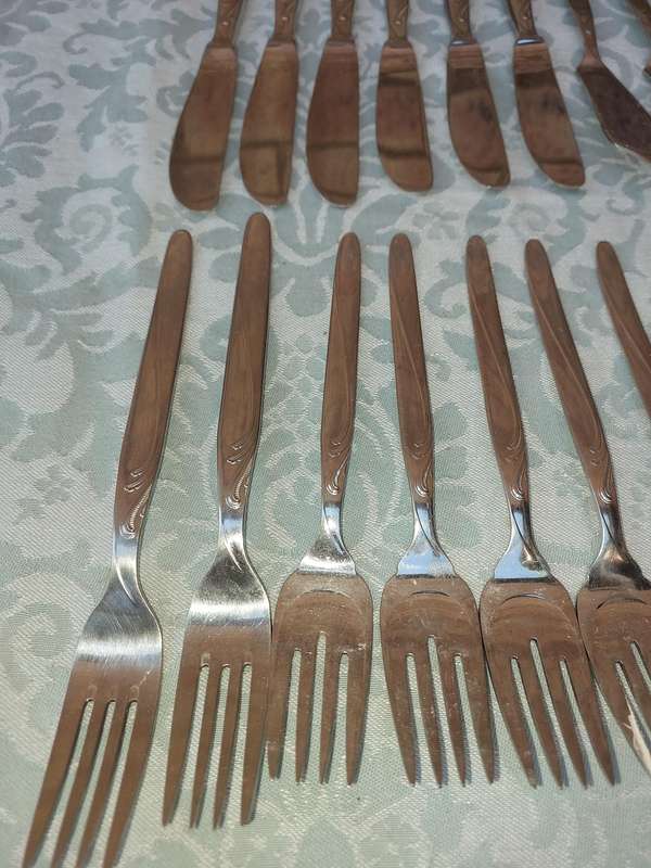 A SET OF VINTAGE GERMAN STAINLESS STEEL CUTLERY SOLD AS IS