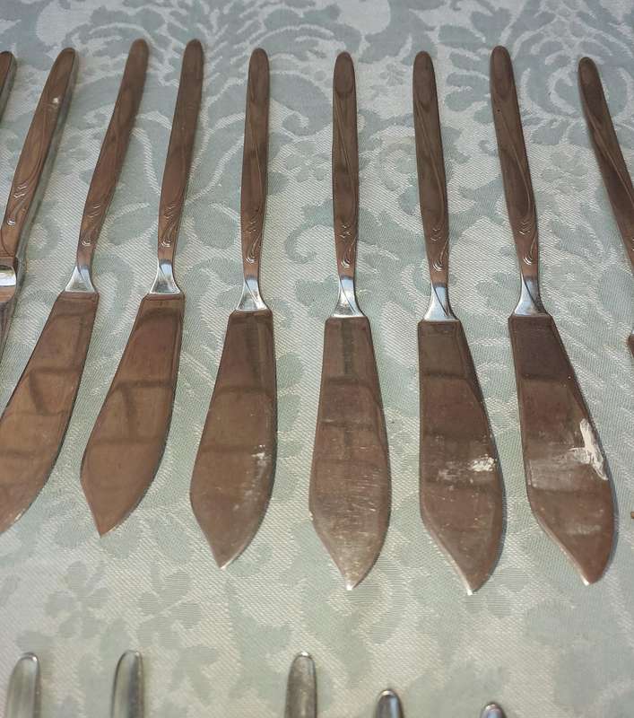 A SET OF VINTAGE GERMAN STAINLESS STEEL CUTLERY SOLD AS IS