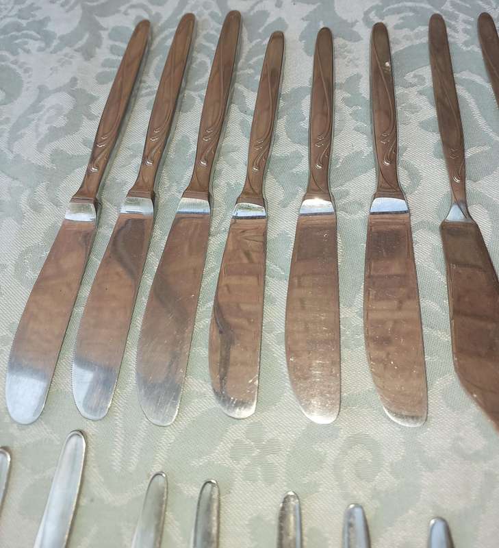A SET OF VINTAGE GERMAN STAINLESS STEEL CUTLERY SOLD AS IS