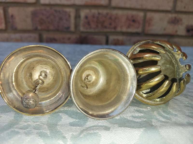 A COLLECTION OF BELLS SOLD AS IS