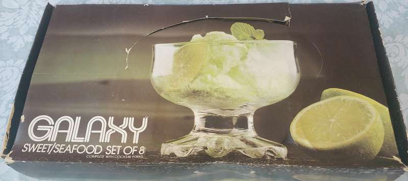 A GALAXY SEAFOOD OR DESERT GLASS SET WITH FORKS SOLD AS IS