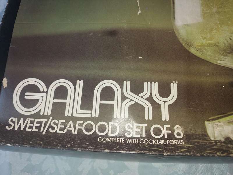 A GALAXY SEAFOOD OR DESERT GLASS SET WITH FORKS SOLD AS IS