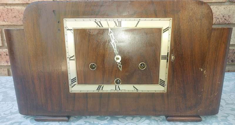 AN ANTIQUE PADESTAL CLOCK WITH THE WINDING KEYS MADE IN ENGLAND AND CHIMES SOLD AS IS