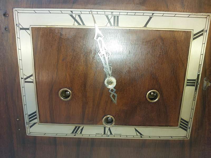 AN ANTIQUE PADESTAL CLOCK WITH THE WINDING KEYS MADE IN ENGLAND AND CHIMES SOLD AS IS
