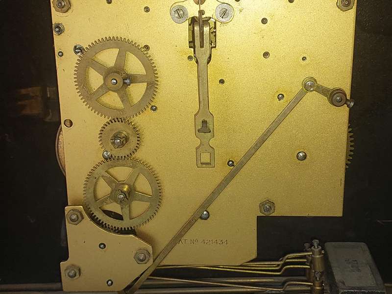 AN ANTIQUE PADESTAL CLOCK WITH THE WINDING KEYS MADE IN ENGLAND AND CHIMES SOLD AS IS