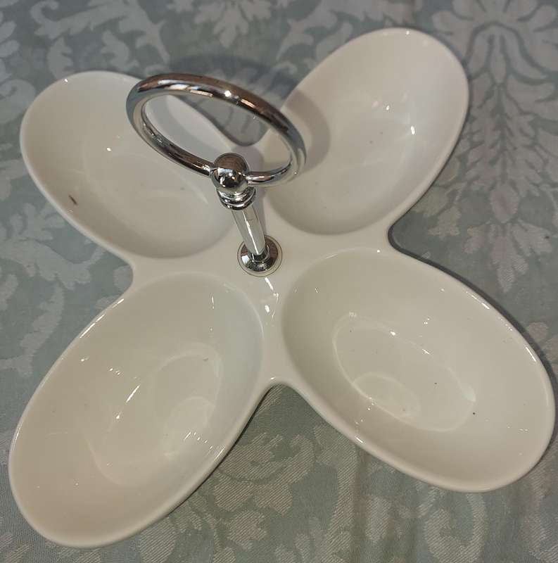 A PORCELAIN FOUR COMPARTMENT SWEET STAND SOLD AS IS
