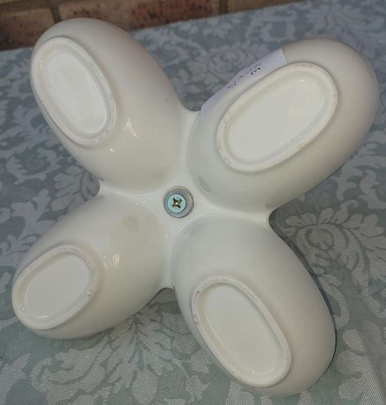 A PORCELAIN FOUR COMPARTMENT SWEET STAND SOLD AS IS