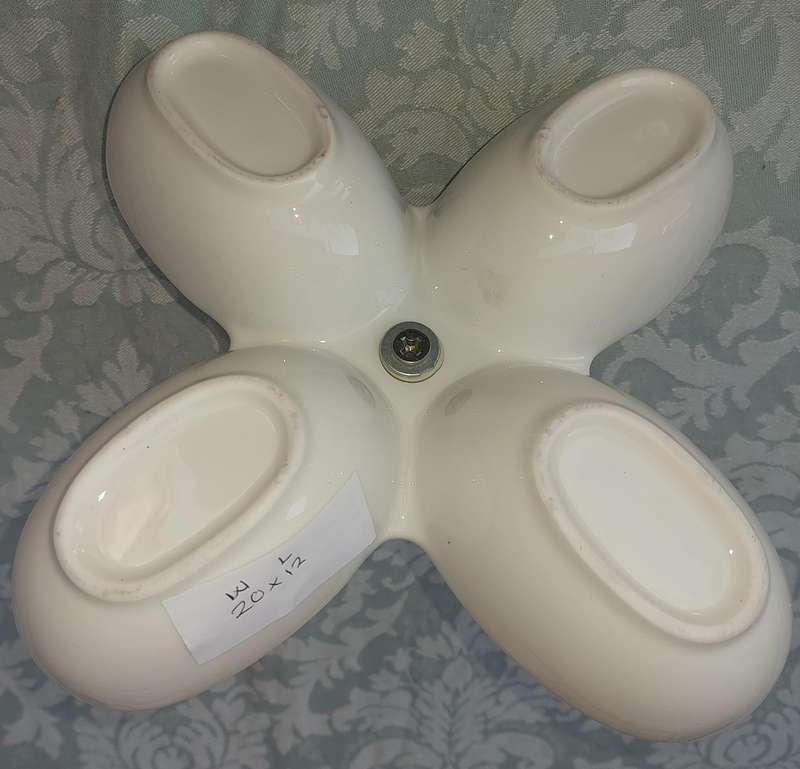A PORCELAIN FOUR COMPARTMENT SWEET STAND SOLD AS IS