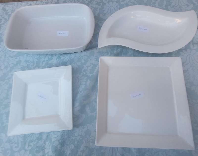 A COLLECTION OF BASIC WHITE PORCELAIN SERVING PLATTERS SOLD AS IS